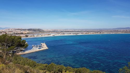 High angle view of sea against blue sky