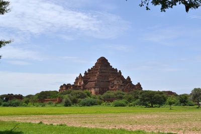 View of temple against cloudy sky