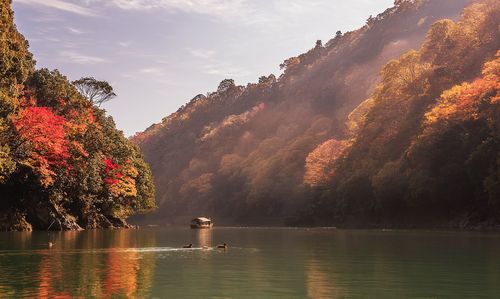 Scenic view of lake against sky during autumn