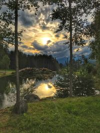 Scenic view of lake against sky during sunset