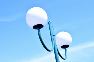 Low angle view of street light against sky