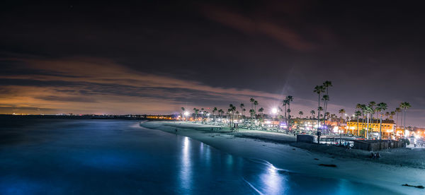 Scenic view of sea against sky at night