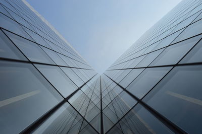 Low angle view of electricity pylon against sky