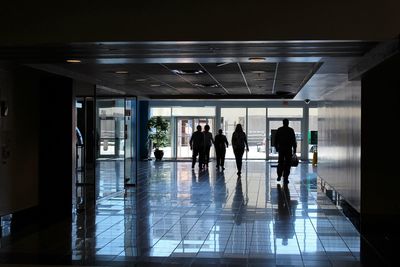 People walking on building corridor