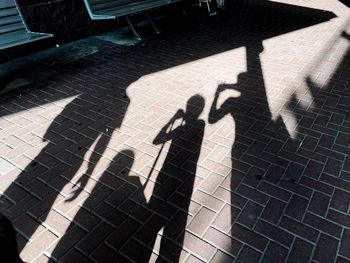 Shadow of man on tiled floor