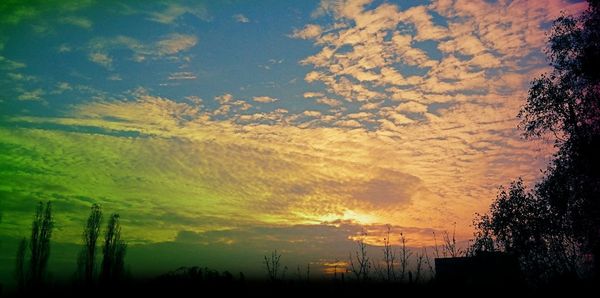 Scenic view of landscape against sky during sunset