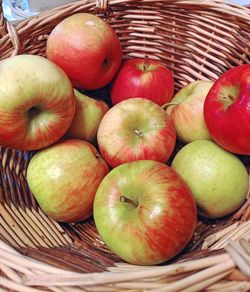 High angle view of apples in basket on table