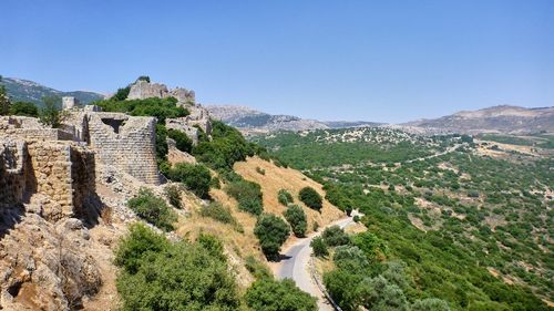 High angle view of castle on mountain against sky