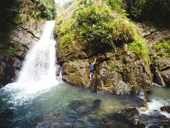 River flowing through rocks in forest