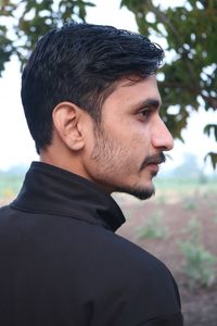 Portrait of young man looking away