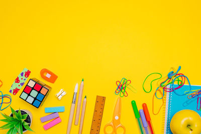 High angle view of toy on yellow background