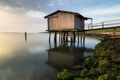 Pier amidst sea against sky