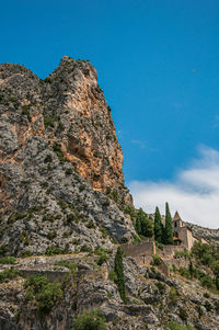 Notre-dame de beauvoir church amidst cliffs near moustiers-sainte-marie, in the french provence.