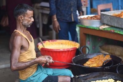 Man preparing food on barbecue grill