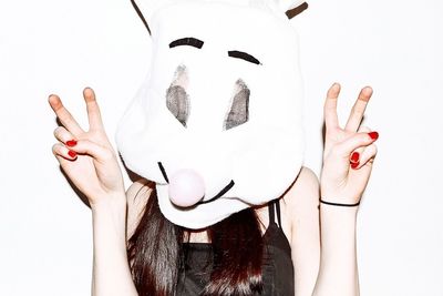 Close-up of woman over white background