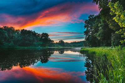 Scenic view of lake against sky during sunset