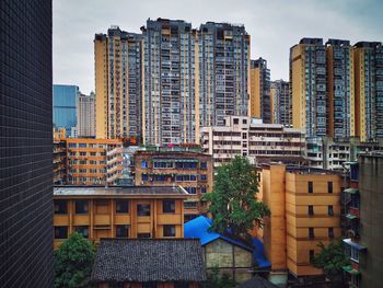 Modern buildings in city against sky