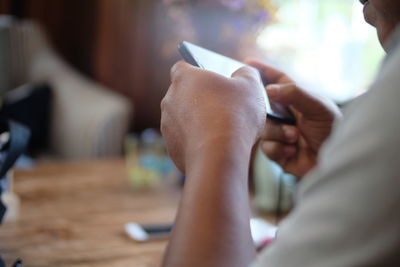 Close-up of person hands using smart phone