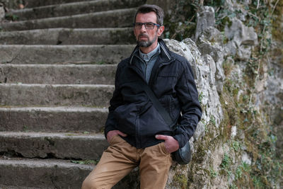 Full length portrait of man standing outdoors