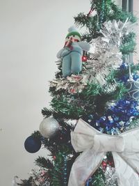 Christmas decorations hanging on tree