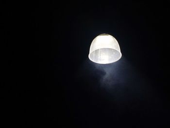 Low angle view of illuminated electric lamp