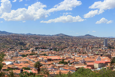 Aerial view of townscape against sky