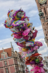 Low angle view of statues on building against sky