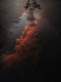 Reflection of sky on puddle