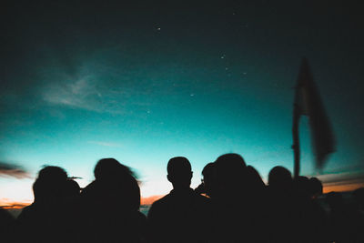 Rear view of silhouette people at music concert