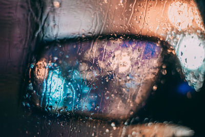 Close-up of raindrops on glass window