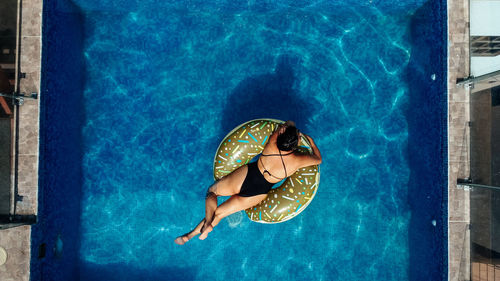 Woman swimming in pool