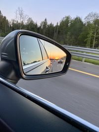 Reflection of car on side-view mirror