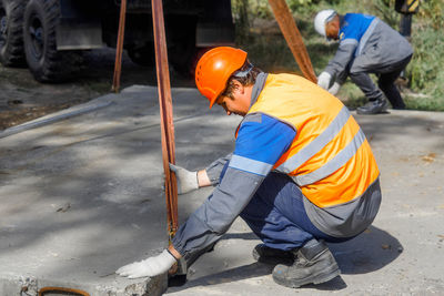 Low section of man working at construction site