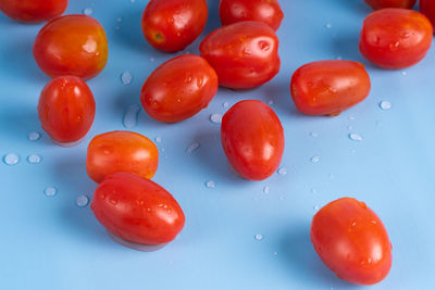 Close-up of wet cherry tomatoes in water