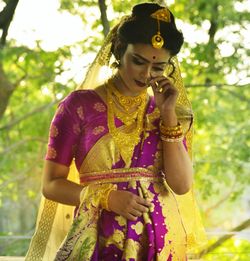 Young woman wearing sari during wedding ceremony