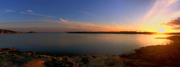 Scenic view of lake at sunset