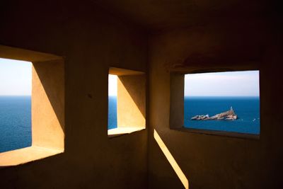 Scenic view of sea seen through windows