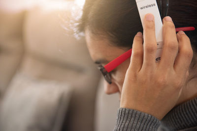 Close-up portrait of man using mobile phone