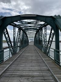 Bridge over footbridge against sky