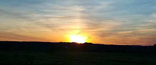 Scenic view of landscape at sunset