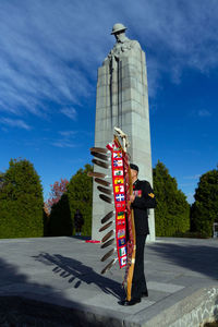 Low angle view of sculpture against blue sky