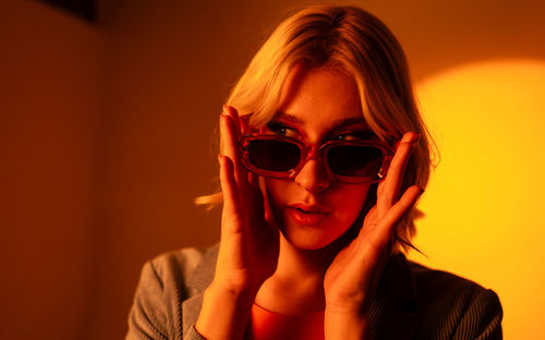 Portrait of young woman wearing sunglasses