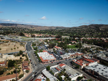 High angle view of city street against sky