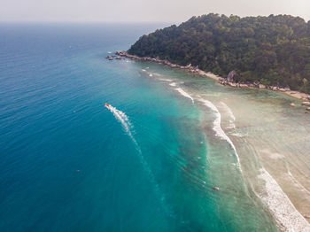 High angle view of sea shore against sky