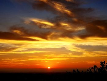 Scenic view of dramatic sky during sunset