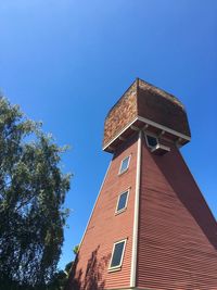 Low angle view of tower against clear blue sky