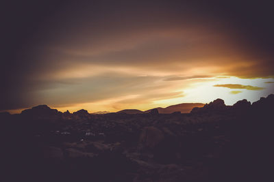 Scenic view of mountains against sky during sunset