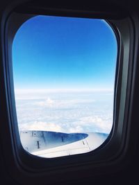 Aerial view of sea seen through airplane window