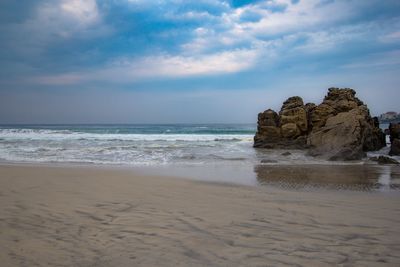 Scenic view of beach against sky