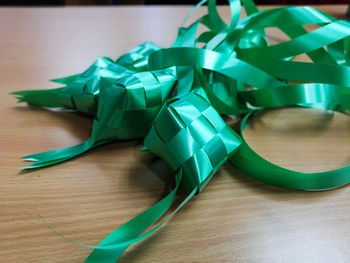 High angle view of green paper on table